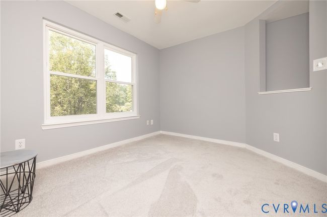 Empty room with carpet flooring and ceiling fan | Image 31