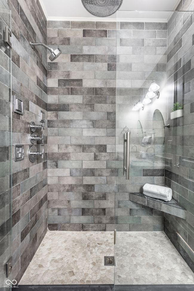 bathroom with a shower stall and ornamental molding | Image 24