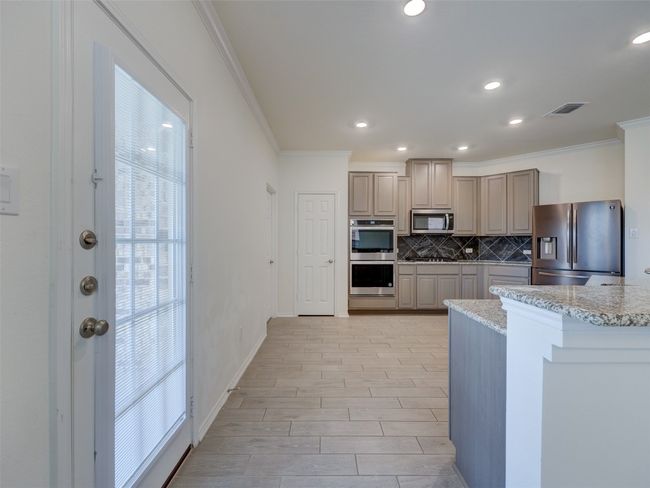 Stainless appliances - custom color cabinetry | Image 13