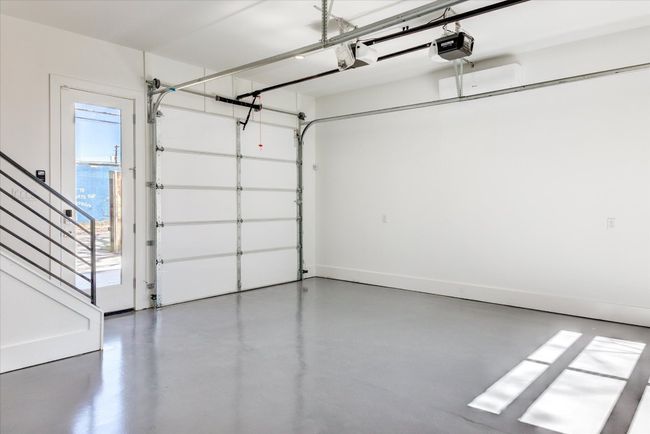 If you choose to utilize this space as a garage, the climate control is still a huge convenience - and to get a covered/enclosed parking spot in centrally located Holly is certainly a luxury! | Image 34