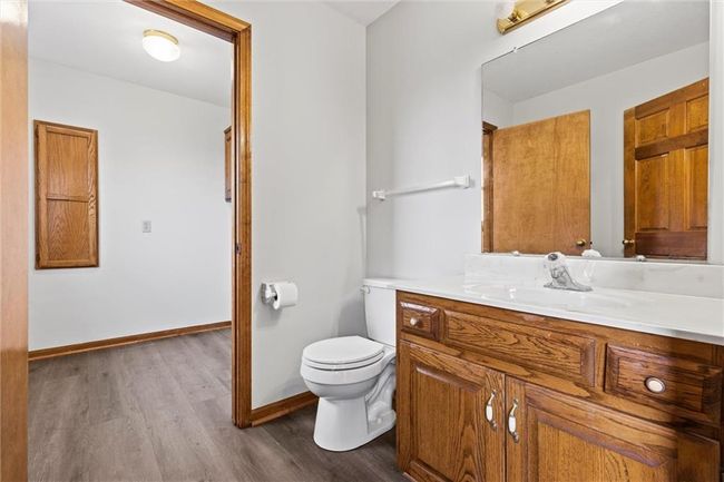 Bathroom with wood-type flooring, vanity, and toilet | Image 18