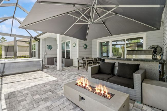 Large extended screened patio with firepit | Image 32