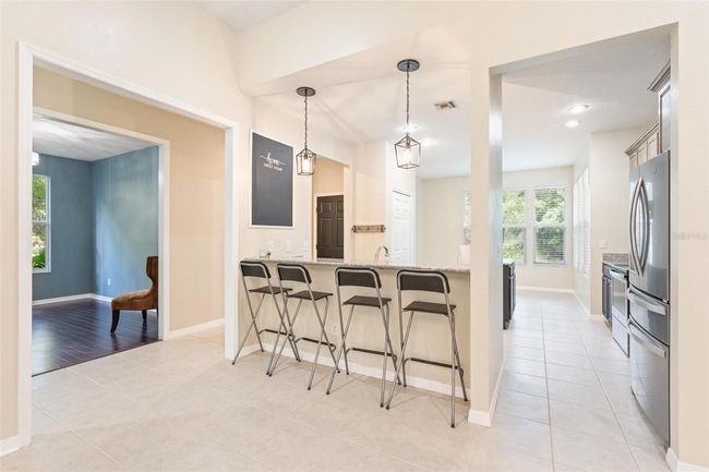 11933 Pasco Trails Blvd, House other with 4 bedrooms, 3 bathrooms and null parking in SPRING HILL FL | Image 8
