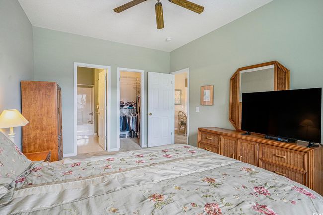Bedroom with a spacious closet, a closet, a ceiling fan, and ensuite bath | Image 9