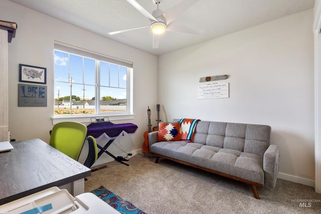 Carpeted office with baseboards and a ceiling fan | Image 19