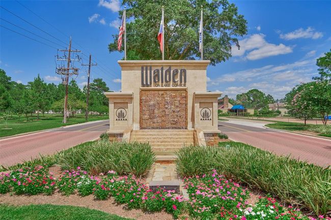 With its grand design and well-maintained landscaping, the entrance to the Walden community creates an impressive and welcoming first impression. | Image 43