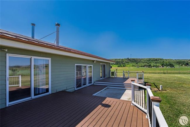 Back deck w payio doors to master bedroom, living room and dining room. | Image 33
