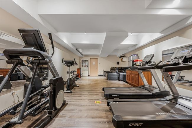 Gym with light wood finished floors | Image 9