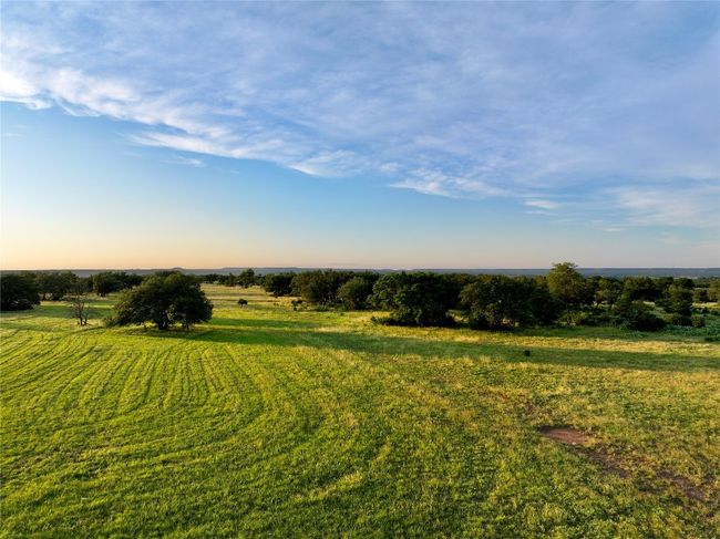 Yard at dusk featuring a view of rural / pastoral area | Image 23