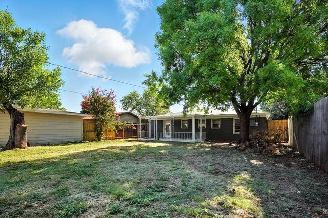 Back of house with a fenced backyard | Image 26