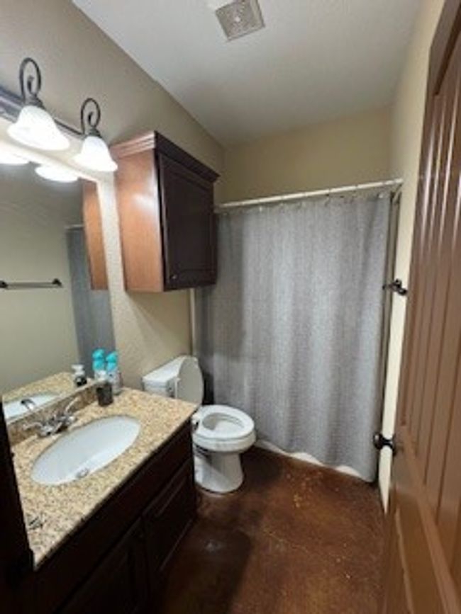 Full bathroom featuring vanity and a shower with shower curtain | Image 14