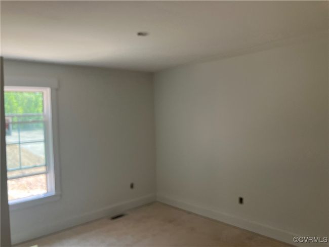 Spare room with plenty of natural light and baseboards | Image 23