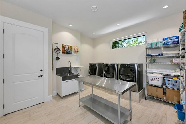 Office area featuring separate washer and dryer and recessed lighting | Image 66