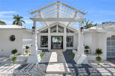 View of exterior entry featuring a pergola | Image 1