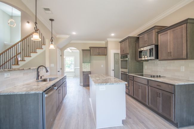 Large Kitchen with a Cooktop, SMART Double Oven, Granite Countertops, Tile Backsplash, Recessed Lighting, Bar Area and Lots of Cabinetry - All with Soft Close Doors & Drawers!! | Image 7