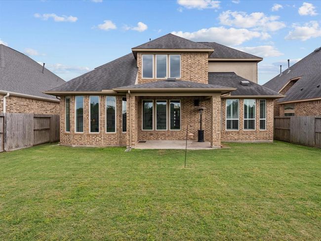 Nice size back yard with a covered patio and no back neighbors | Image 40