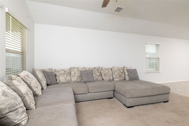 Living room with ceiling fan and baseboards | Image 19