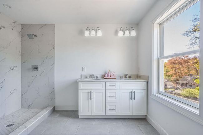 Unit #2: Right side, master bathroom with shower and double sinks. | Image 26