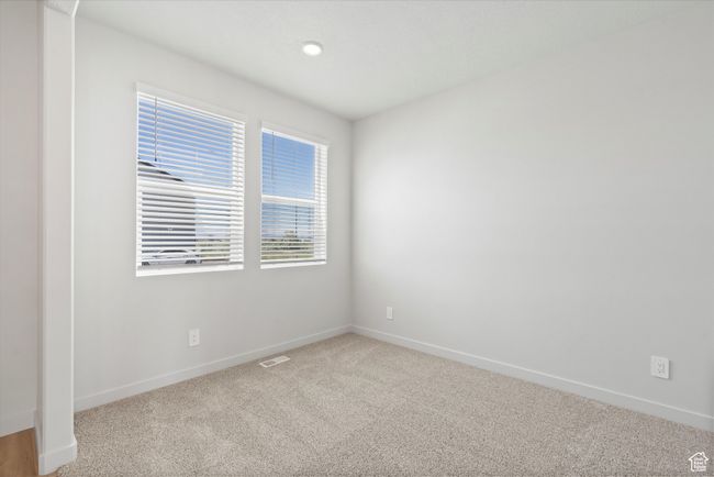 Carpeted spare room with baseboards | Image 11