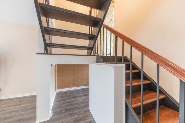Stairway with wood finished floors and baseboards | Image 13