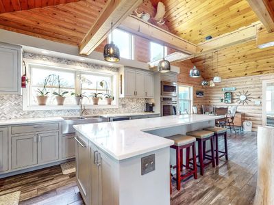 Amazing log home built in 2021 on 25 acres; featuring an open floor plan, vaulted ceilings, fabulous finishes throughout PLUS a 1-bedroom/1 bathroom in-law suite located above the 3 car garage - not included in TFSF | Image 1