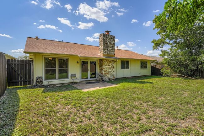 Private backyard with patio—ideal for enjoying your morning coffee or evening beverage. | Image 14