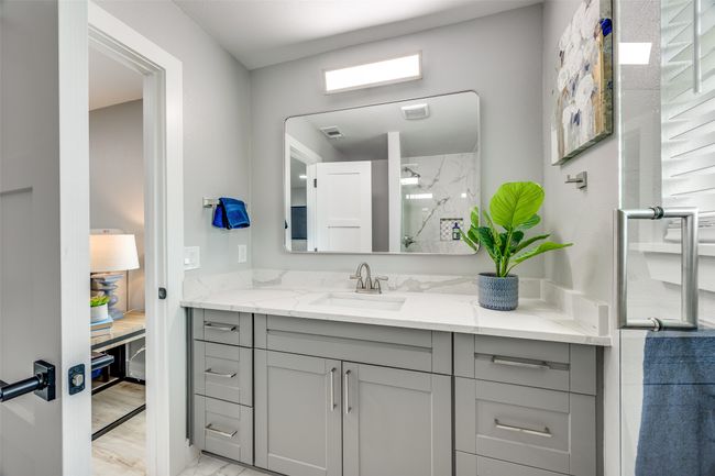Bathroom with vanity, a shower, and marble finish flooring | Image 21