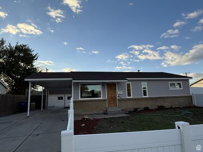 View of front facade featuring a carport and a front lawn | Image 1