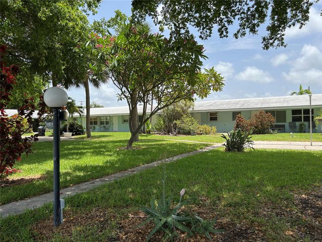 EXPANSIVE YARD WITH TREES;COMMON PATIO'S;BIKE RACK | Image 24