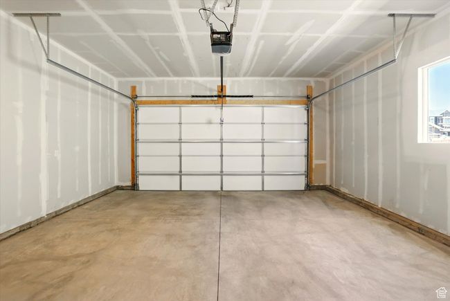 Garage with a garage door opener | Image 30