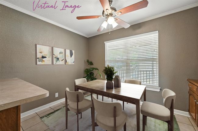 Unfurnished room featuring ornamental molding, ceiling fan, light tile patterned flooring, and a textured wall | Image 9