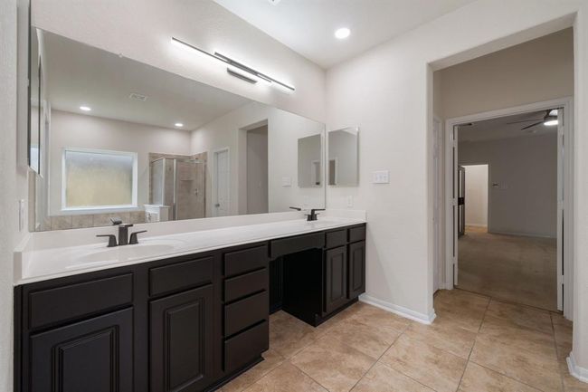 Primary bath with double sinks and makeup space | Image 18