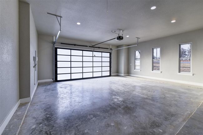 Garage featuring a garage door opener | Image 34