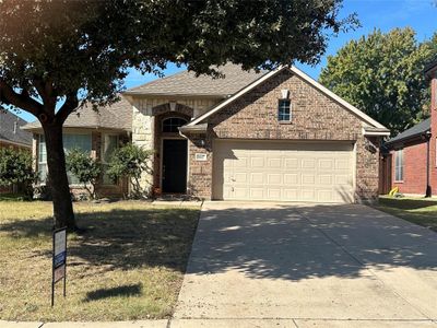 Front of property with a front lawn and a garage | Image 1