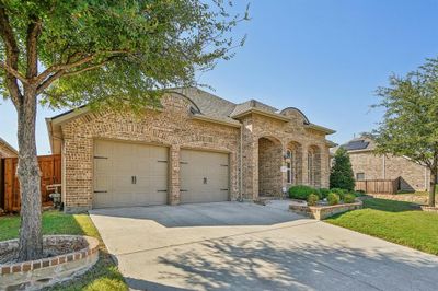 View of front of house with a front lawn and a garage | Image 2