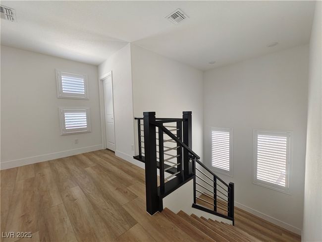 Stairs featuring baseboards, visible vents, and wood finished floors | Image 22