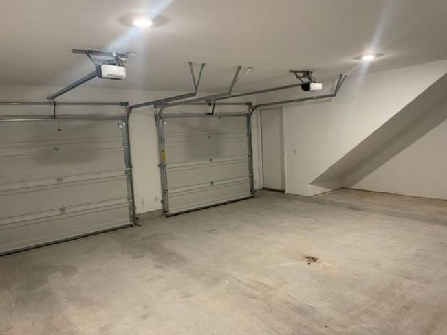 Garage featuring a garage door opener | Image 9