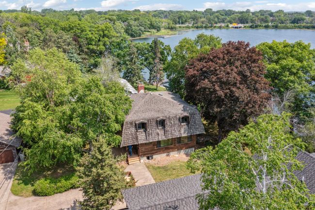 The roof is asphalt shingles surrounded by cedar shakes. | Image 32