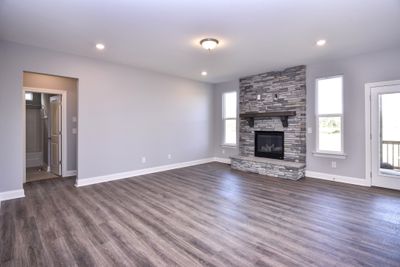 Spacious Great Room with stone fireplace. Fireplace with different looks is an option! Photo is not actual home. | Image 3