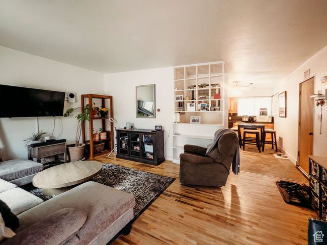 Living area featuring light wood-style floors | Image 6