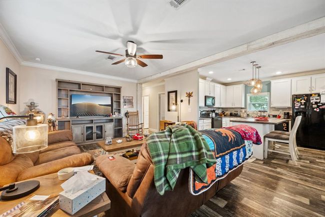 The kitchen is open to the family room so you and your family stay connected! | Image 8