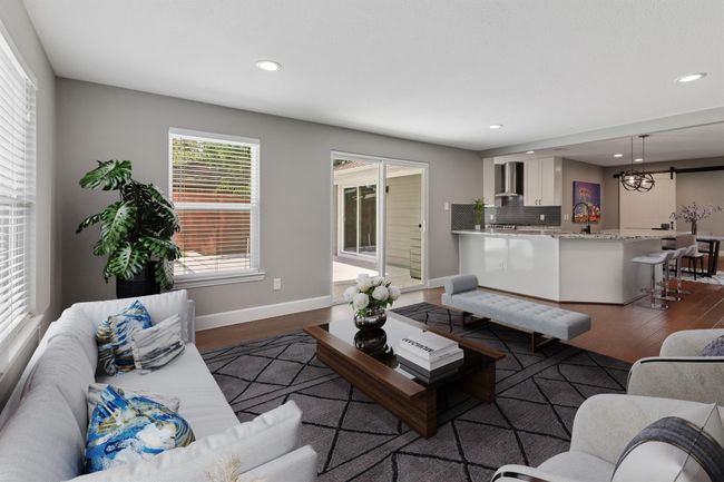 View from the family room overlooking into the kitchen. This view really captures the bright and open feel of the home. *Virtually staged photo* | Image 11