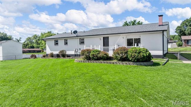 Back of property with a chimney and brick siding | Image 34