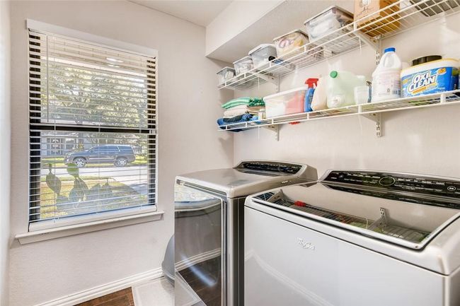 Laundry room featuring washer and dryer and baseboards | Image 23