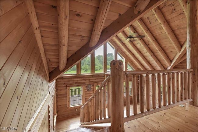 Staircase to the second floor loft and primary bedroom | Image 18