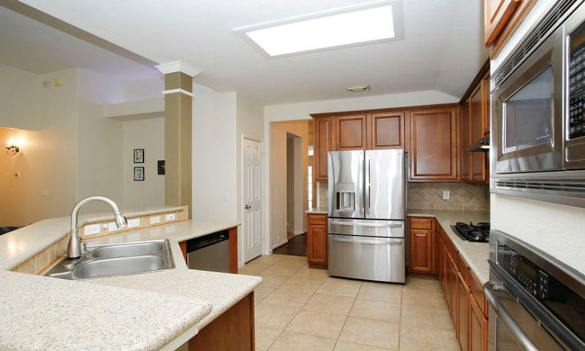 Another view of the kitchen looking back towards the front door. Fridge will be included in the sale of the home. | Image 5