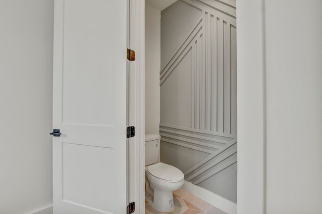 Bathroom featuring toilet and tile patterned flooring | Image 16