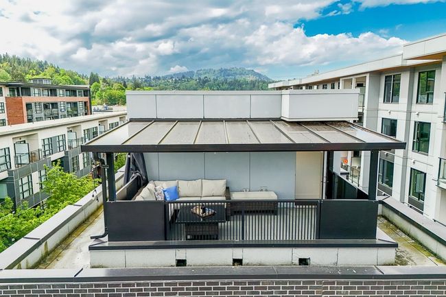 Wooden terrace with an outdoor hangout area | Image 31