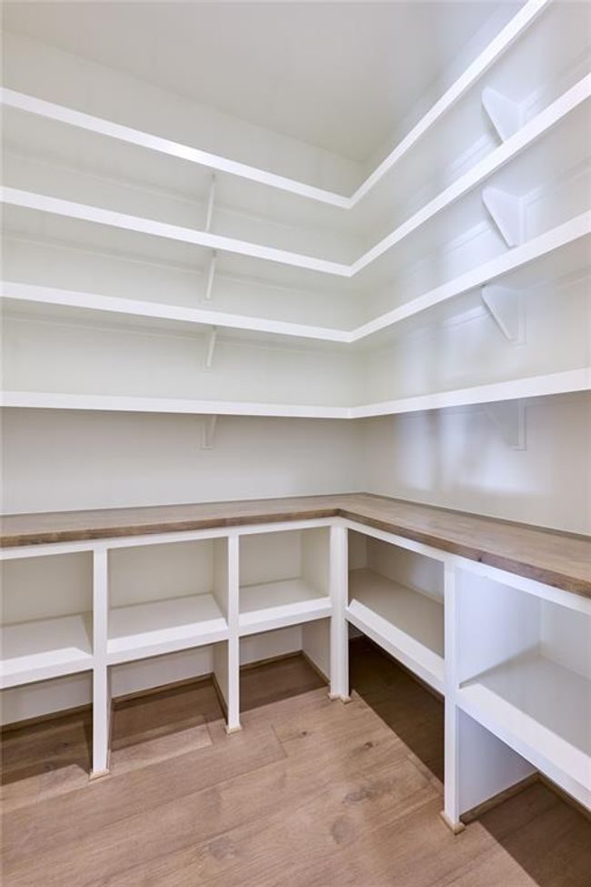 Generously sized walk-in pantry, providing ample storage and easy organization for all your kitchen essentials. | Image 23