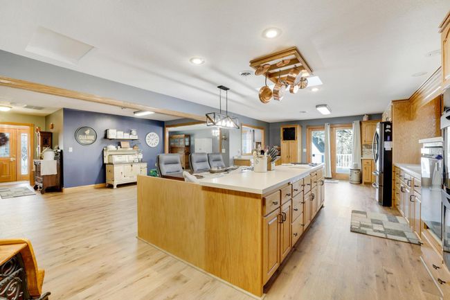 Newer LVP floors throughout this awesome spacious kitchen with french door access to the huge deck. | Image 12